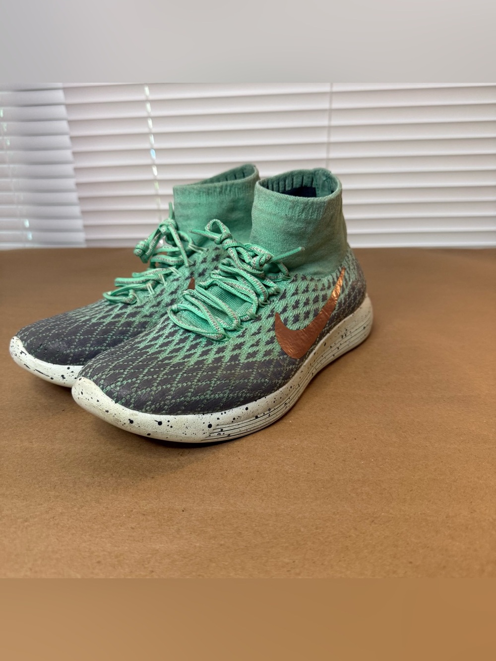 Nike Women's Flyknit High-Top Sneakers in Mint Green and Copper